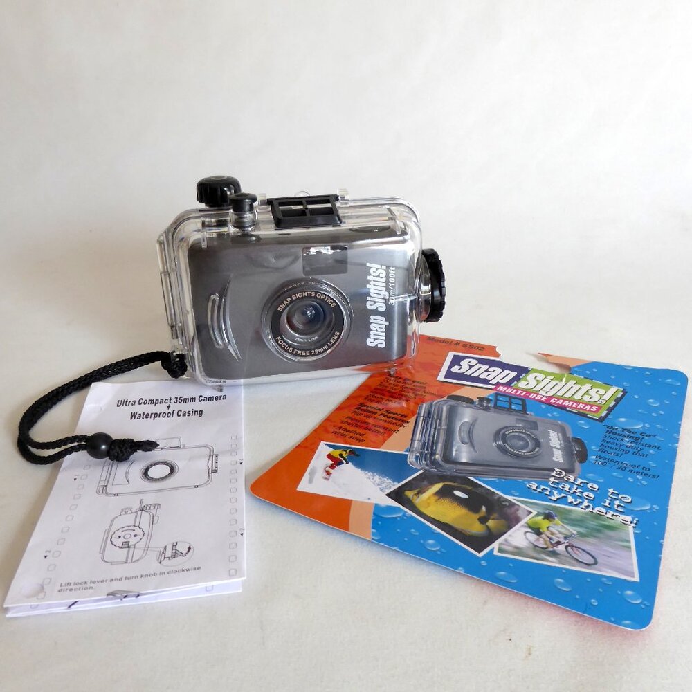 USED ONCE WATERPROOF SPORT UTILITY COMPACT 35mm CAMERA IN CASING
